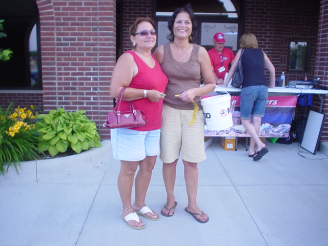 Denise' presents $50 to the MADD raffle money winner